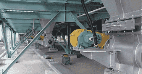 Conveyor under dust collector